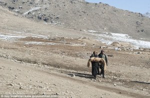 Agfhan collecting the dead